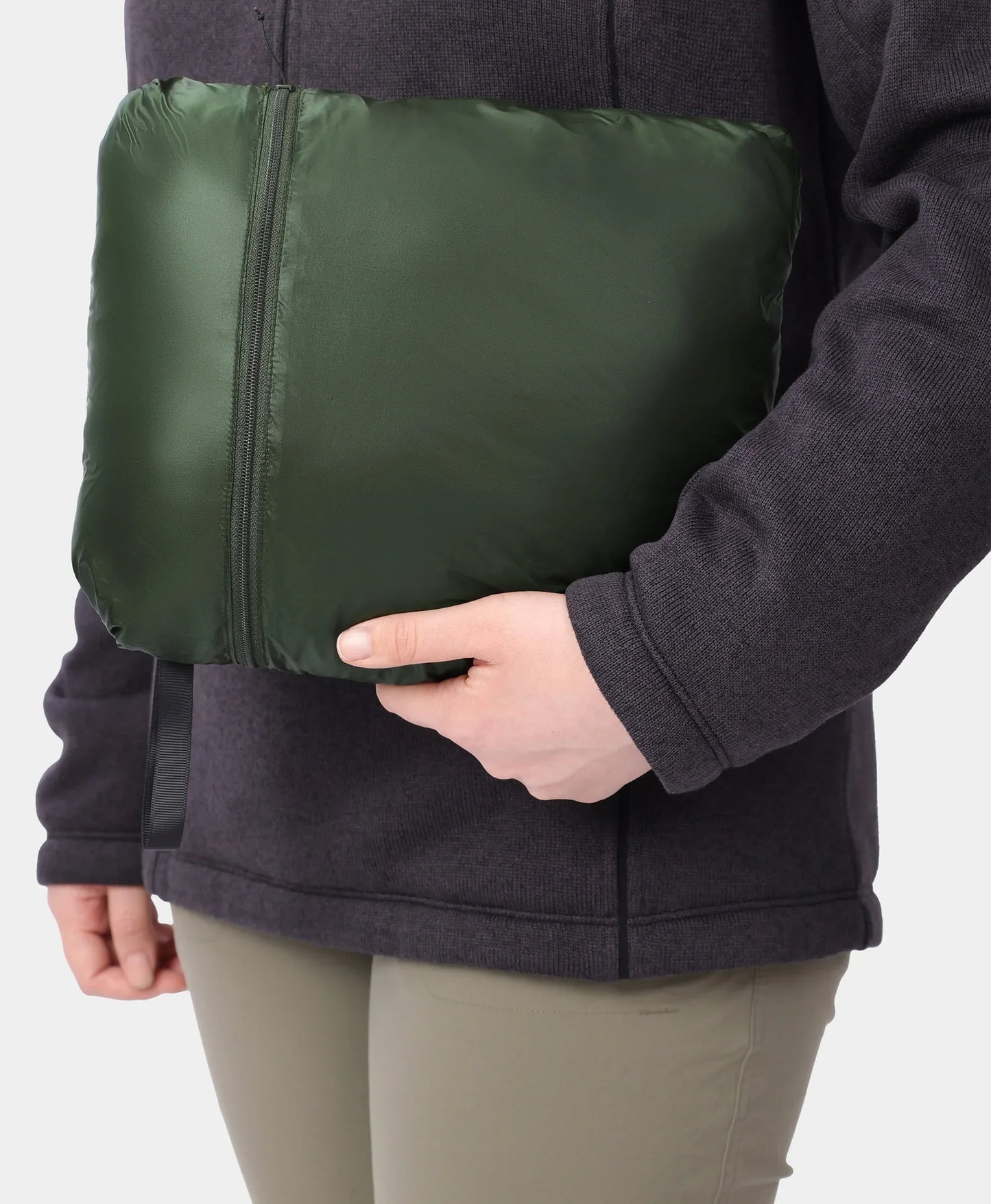 Jacket packs into itself via a large inner pocket and zipper closure